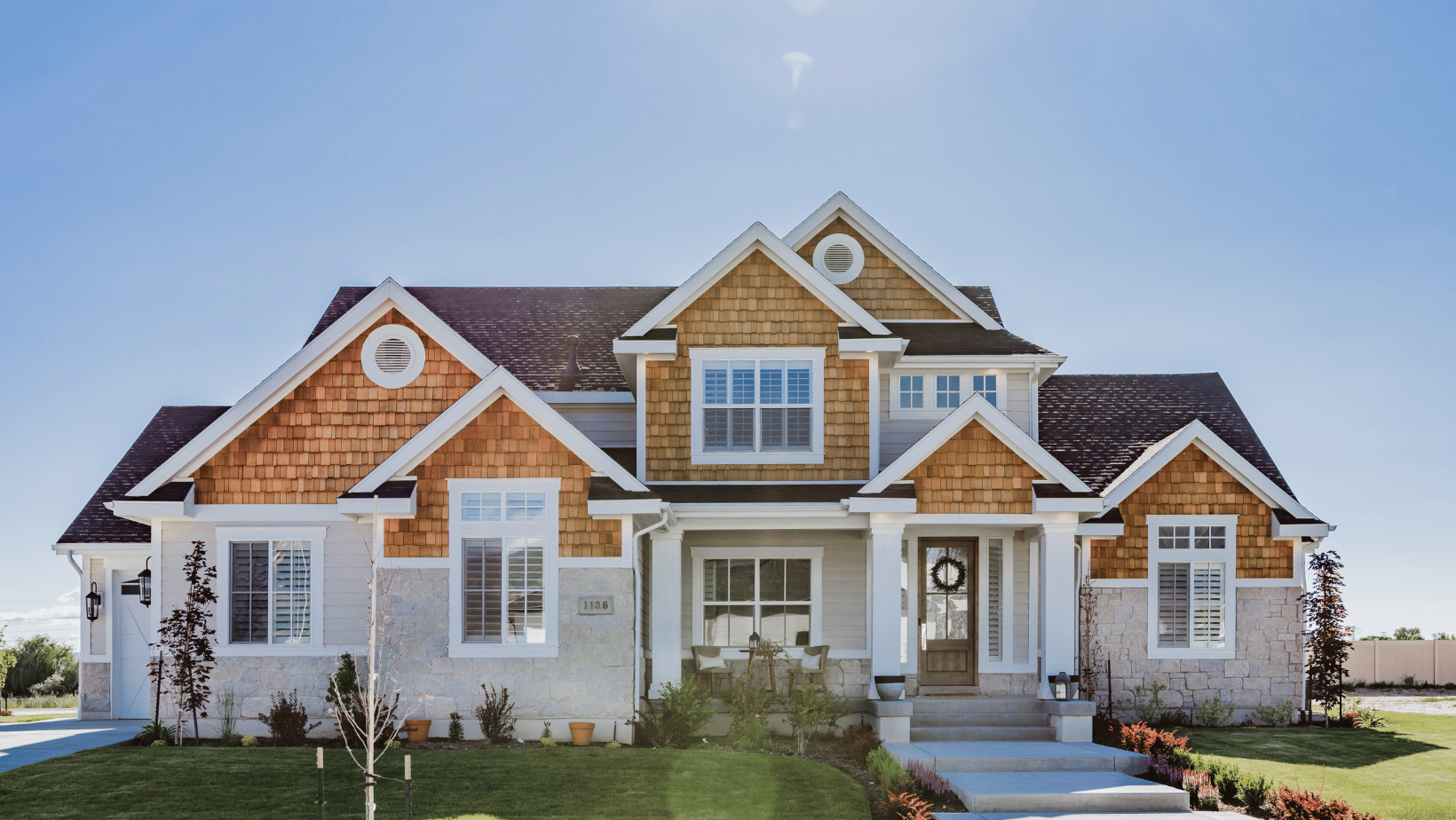 Large home with blue sky behind it